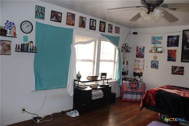 bedroom with dark wood-style floors and ceiling fan