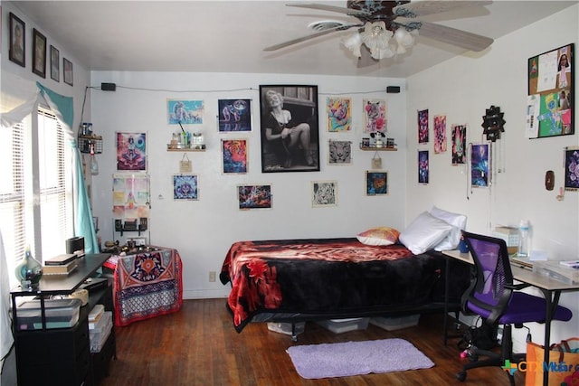 bedroom with wood finished floors and a ceiling fan