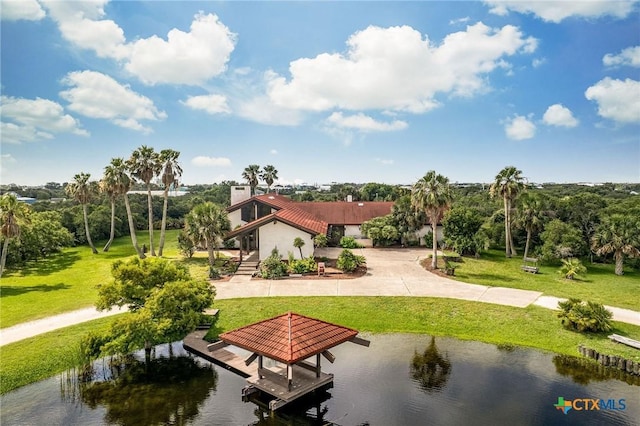 1809 W Harrison Ave, Port Oconnor, TX 77982 - surrounding community with a water view, a lawn, and a dock