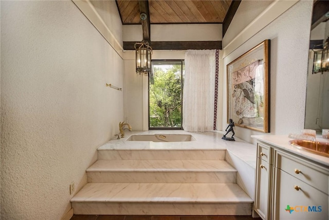 1809 W Harrison Ave, Port Oconnor, TX 77982 - full bath featuring a textured wall, vanity, a bath, and wood ceiling