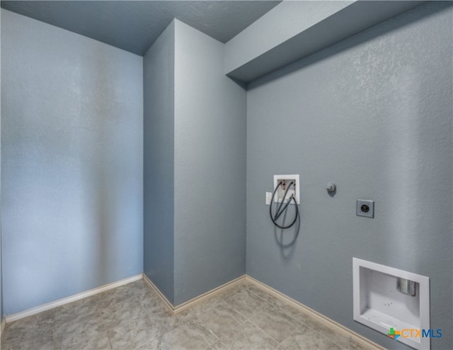 1413 Doncaster Dr, Seguin, TX 78155 - laundry room with hookup for a gas dryer, washer hookup, hookup for an electric dryer, laundry area, and baseboards
