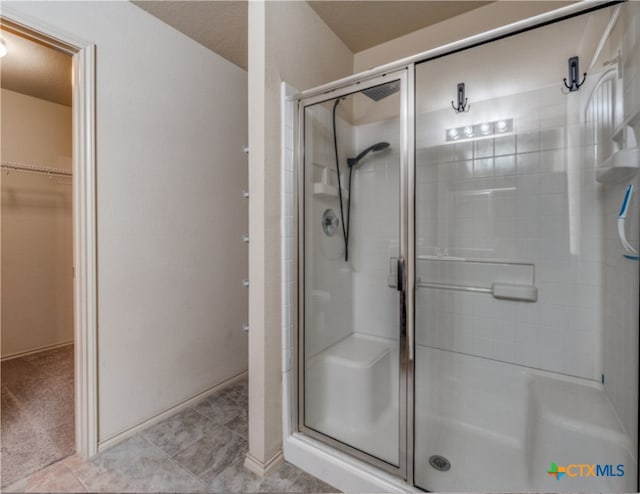 1413 Doncaster Dr, Seguin, TX 78155 - bathroom with a shower stall and a spacious closet