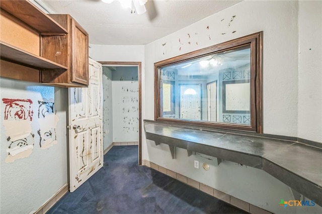 kitchen featuring dark colored carpet