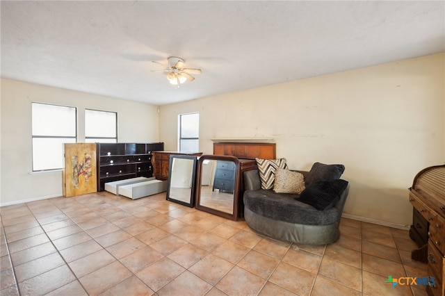 tiled bedroom with ceiling fan