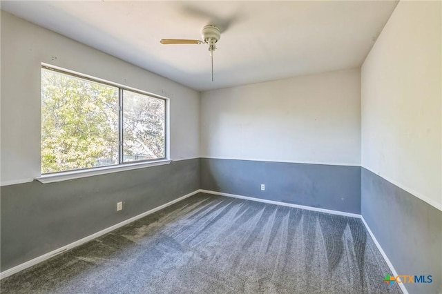 empty room featuring carpet flooring and ceiling fan