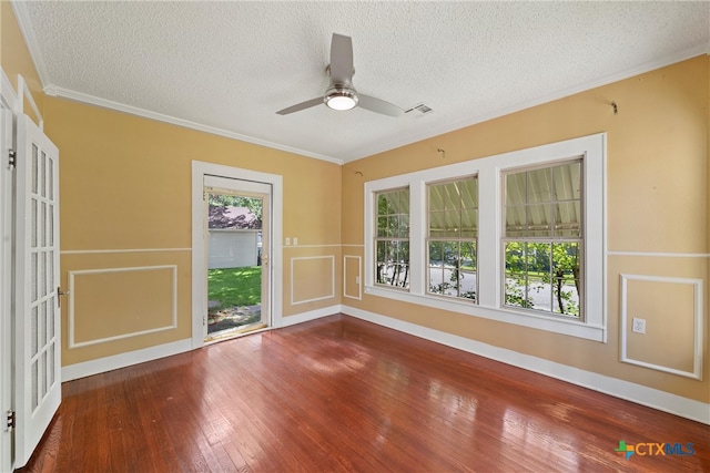 unfurnished room with crown molding, hardwood / wood-style floors, a textured ceiling, and ceiling fan