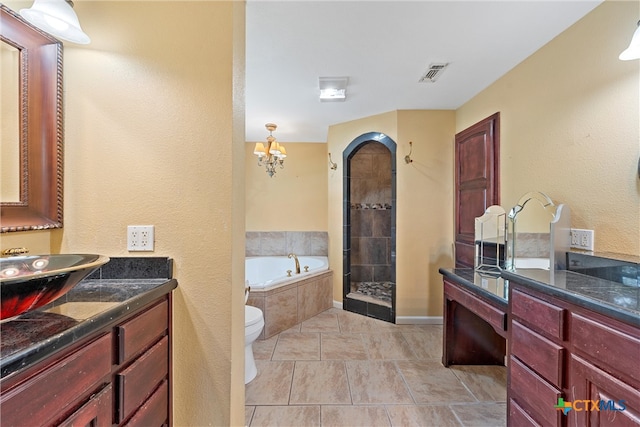 full bathroom featuring tile patterned floors, vanity, plus walk in shower, toilet, and a chandelier