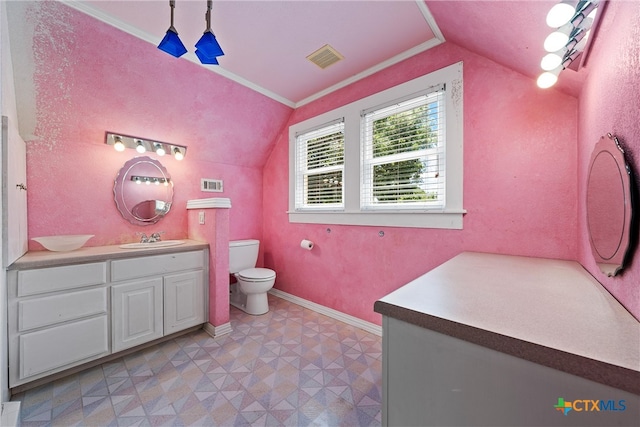 bathroom featuring tile patterned floors, crown molding, vanity, vaulted ceiling, and toilet