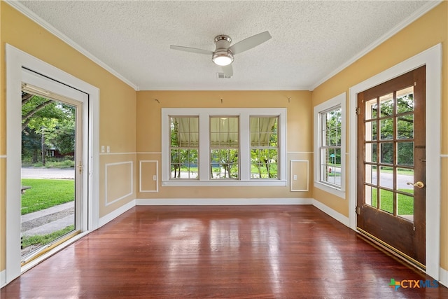 unfurnished sunroom with a wealth of natural light and ceiling fan