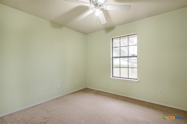 unfurnished room featuring carpet flooring and ceiling fan