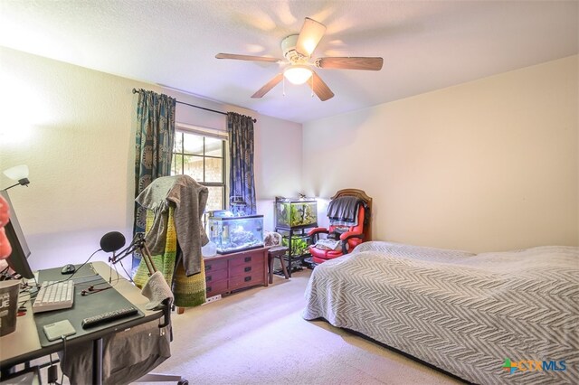 bedroom with ceiling fan and light colored carpet