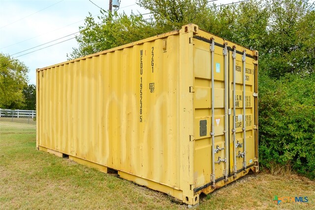 view of outdoor structure with a yard