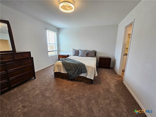 carpeted bedroom featuring ensuite bath