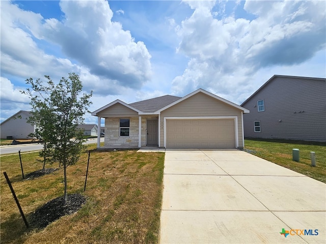 view of front of house with a garage and a front yard