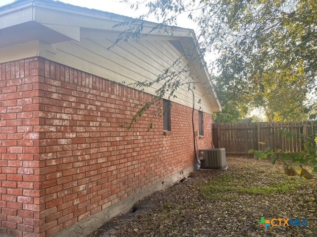 view of home's exterior with central AC unit