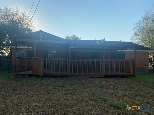 back of house featuring a deck