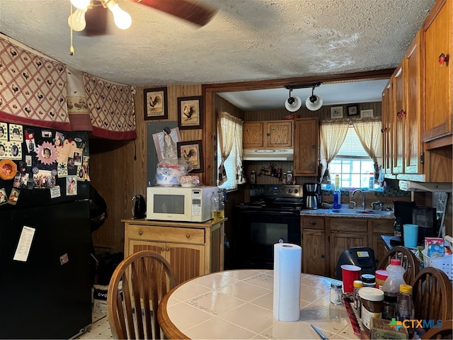 kitchen with black appliances, a textured ceiling, ceiling fan, and sink