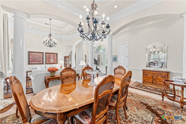 tiled dining area with a chandelier, crown molding, and decorative columns