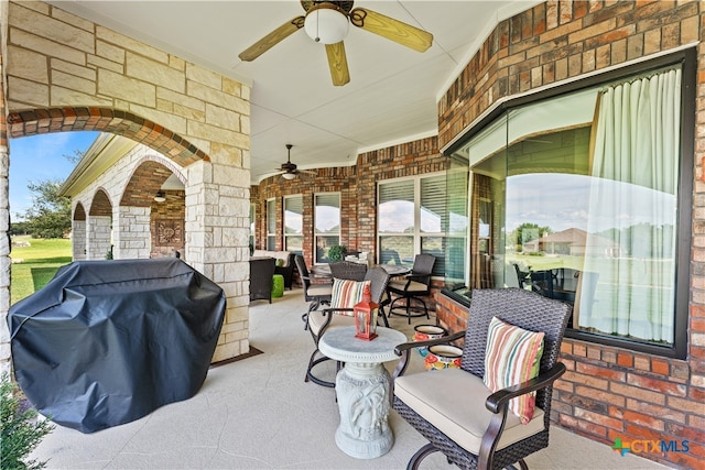 view of patio / terrace with area for grilling and ceiling fan