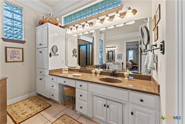 bathroom with vanity, tile patterned floors, and ornamental molding