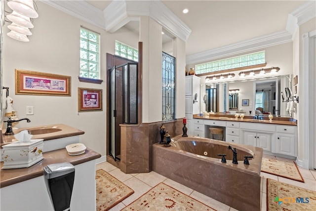 bathroom with plus walk in shower, vanity, tile patterned floors, and ornamental molding