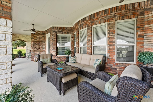 view of patio / terrace with ceiling fan and an outdoor hangout area