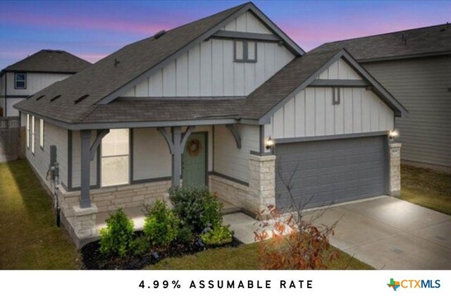 view of front of property featuring central AC, a porch, a garage, and a lawn