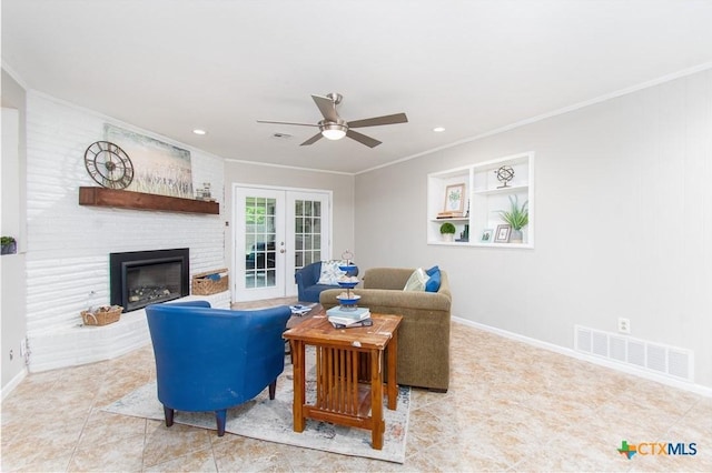4512 Briar Cliff Rd, Temple, TX 76502 - living area with french doors, crown molding, a ceiling fan, baseboards, and a brick fireplace