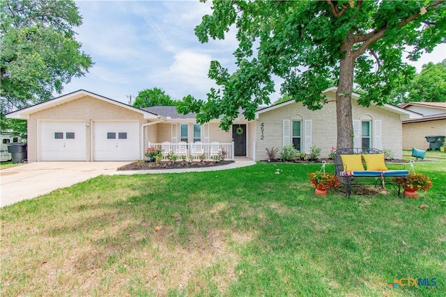 4512 Briar Cliff Rd, Temple, TX 76502 - single story home with a garage, concrete driveway, a porch, a front lawn, and brick siding