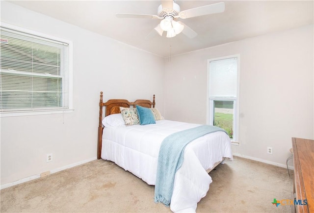 4512 Briar Cliff Rd, Temple, TX 76502 - carpeted bedroom featuring baseboards, multiple windows, and a ceiling fan