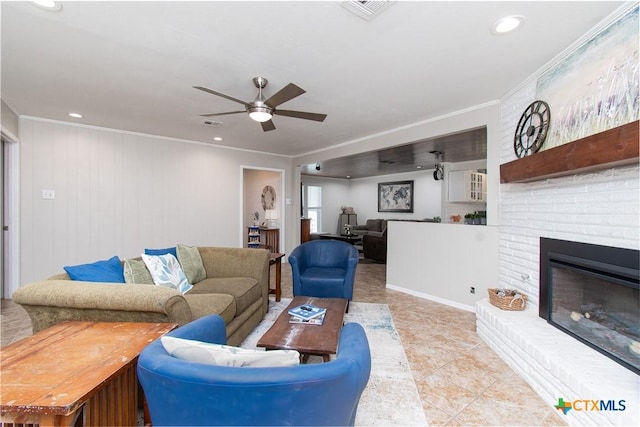 4512 Briar Cliff Rd, Temple, TX 76502 - living area with a ceiling fan, ornamental molding, tile patterned flooring, a fireplace, and recessed lighting