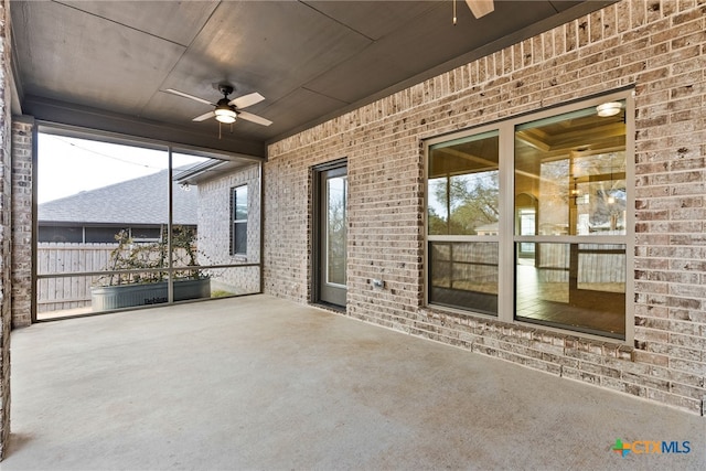 view of patio / terrace featuring fence and a ceiling fan