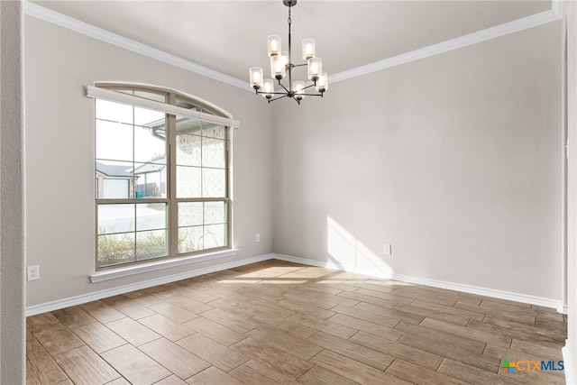 unfurnished room with wood tiled floor, ornamental molding, a chandelier, and baseboards