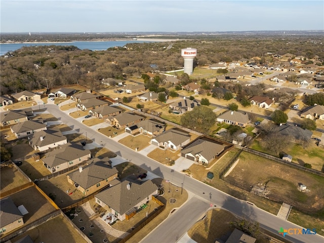 bird's eye view with a water view and a residential view