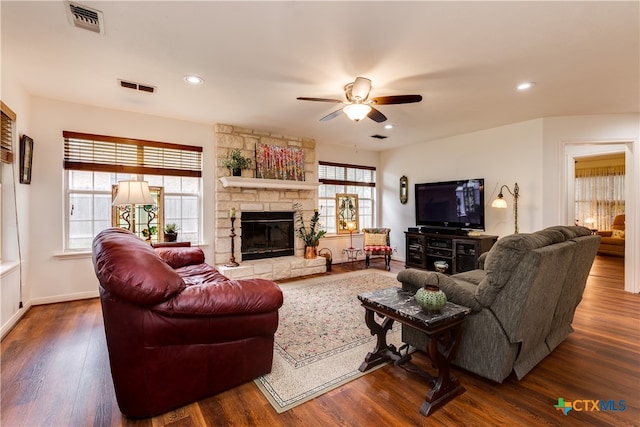 living room featuring hardwood / wood-style flooring, a wealth of natural light, and ceiling fan