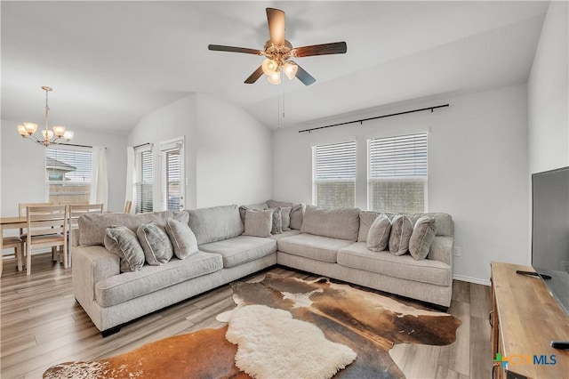 2026 Bee Creek Loop, Copperas Cove, TX 76522 - living room featuring a chandelier, wood finished floors, vaulted ceiling, and a ceiling fan