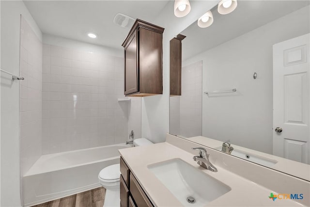 2026 Bee Creek Loop, Copperas Cove, TX 76522 - full bathroom featuring toilet, wood finished floors, vanity, and washtub / shower combination