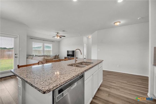 2026 Bee Creek Loop, Copperas Cove, TX 76522 - kitchen with a sink, stainless steel dishwasher, white cabinetry, wood finished floors, and a center island with sink