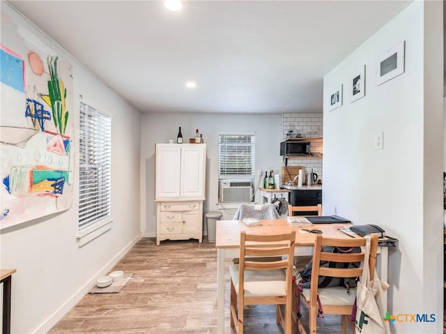 1000 Advance St, San Marcos, TX 78666 - dining space featuring recessed lighting, light wood-type flooring, baseboards, and cooling unit