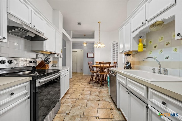 5404 Jim Ave, Killeen, TX 76549 - kitchen featuring stainless steel appliances, under cabinet range hood, a sink, tasteful backsplash, and stone tile floors