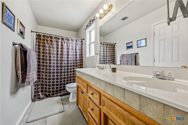 5404 Jim Ave, Killeen, TX 76549 - full bath with double vanity, toilet, a shower with curtain, and tile patterned flooring
