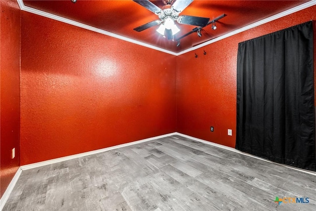 5404 Jim Ave, Killeen, TX 76549 - spare room with wood finished floors, ornamental molding, track lighting, a ceiling fan, and a textured wall