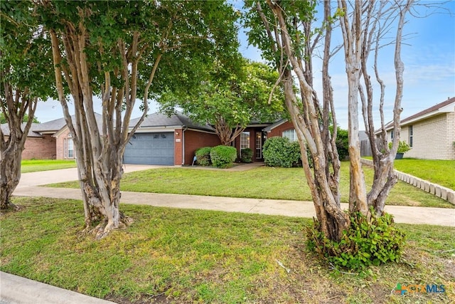 5404 Jim Ave, Killeen, TX 76549 - view of front facade with concrete driveway, a garage, brick siding, and a front yard