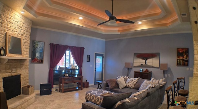 1122 Windy Hill Rd, Harker Heights, TX 76548 - living room with ceiling fan, a tray ceiling, crown molding, and a fireplace