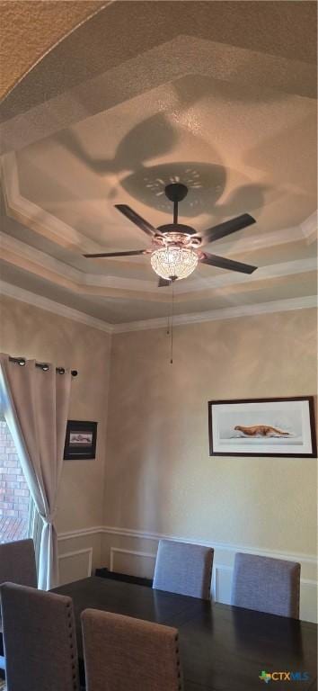 1122 Windy Hill Rd, Harker Heights, TX 76548 - dining space featuring a tray ceiling, crown molding, and a ceiling fan