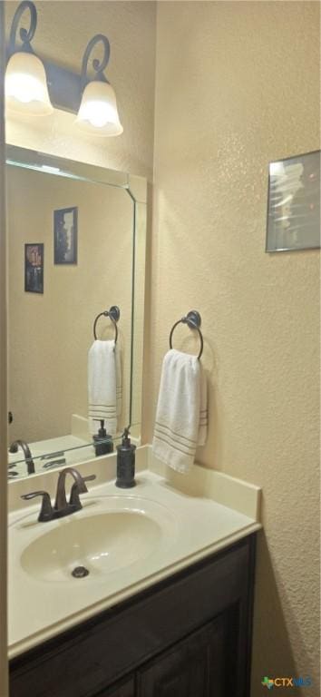1122 Windy Hill Rd, Harker Heights, TX 76548 - bathroom with a textured wall and vanity