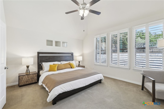 carpeted bedroom with baseboards, lofted ceiling, and a ceiling fan