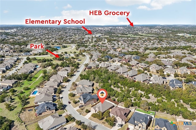 birds eye view of property with a residential view