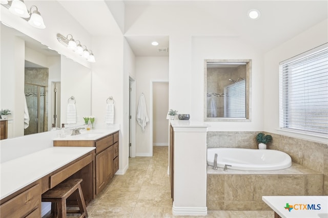 full bath with vanity, recessed lighting, a shower stall, a garden tub, and tile patterned floors