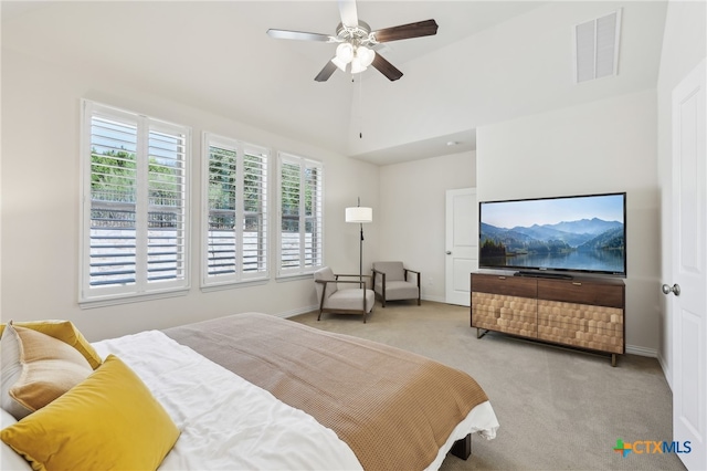 carpeted bedroom with lofted ceiling, baseboards, visible vents, and ceiling fan